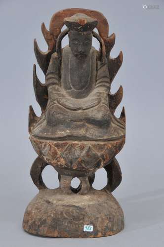 Carved wooden image of the Buddha. China. 19th century. Flame halo at the back (repair). 12-1/2