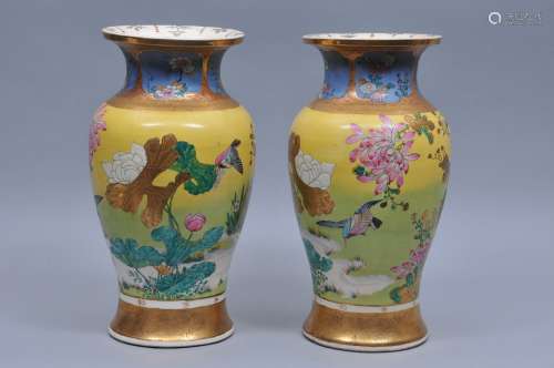 Pair of pottery vases. Japan. Meiji period. (1868-1912). Decoration of kingfishers and flowers with gilt brocade pattern. Signed in a band decoration. 15-1/2