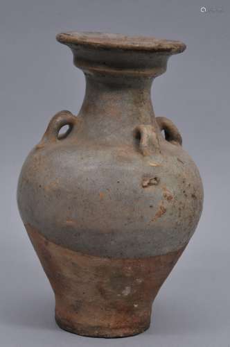 Stoneware wine jar. China. Yuan period. (1279-1368). Flaring lips with four lugs. Pale grey blue glaze. (repairs and cracks). 10-3/4