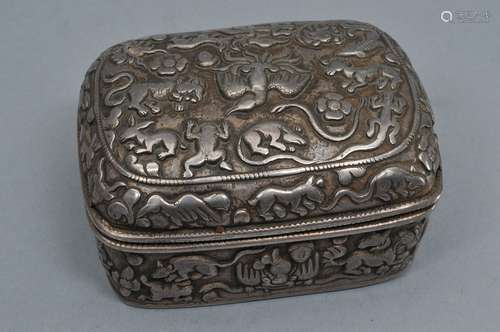 Silver box. Tibet. 18th or 19th century. Rectangular form with rounded corners. Repousse decoration of tigers, frogs, butterflies, monkeys, lizards and other mythical animals. 3-3/4