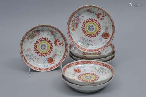 Lot of 7 porcelain saucer dishes, China. 19th century, 8 character Hall mark on the back. Famille rose decoration of Buddhist emblems. 5 1/2