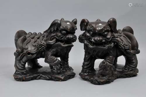 Pair of carved wooden foo dogs.  China. 19th century. 14