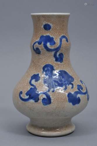 Porcelain vase. China. Late 19th century. Underglaze blue decoration of a ram and floral scrolling on a crackled cream coloured ground. 7-1/2
