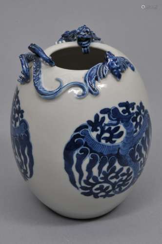 Porcelain vase. China. 19th to early 20th century. Oviform. Relief dragon and bat at the shoulder. Reserves of phoenixes. All decorated in underglaze blue. 7