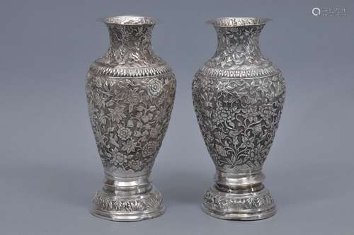 Pair of silver vases. China. 19th century. Repousse work of birds, insects and flowers. Total weight- 31.7 oz. Signed. 9-1/2