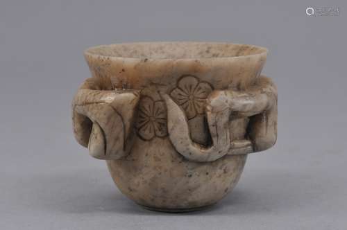 Soapstone wine cup. China. 19th century. Grey stone carved in relief with flowering prunus branches. 2-1/4