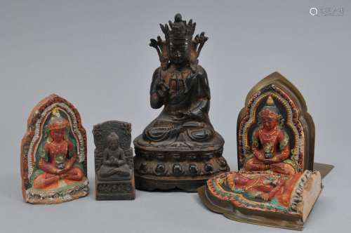 Lot of five Buddhist images. A gilt bronze Ming period Buddha and four moulded potter stelae, three with polychrome details. 6-1/2