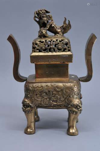 Bronze censer. China. Early 20th century. Square form with heaven soaring handles. 15