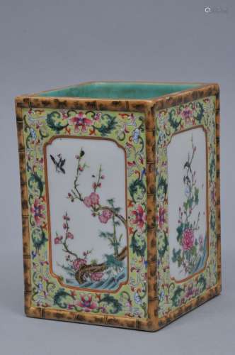 Porcelain brush pot. China. Late 19th to early 20th century. Square form. Famille Rose panels of birds and flowers on a chartreuse lotus scroll ground. Faux bamboo edges. 5-1/2