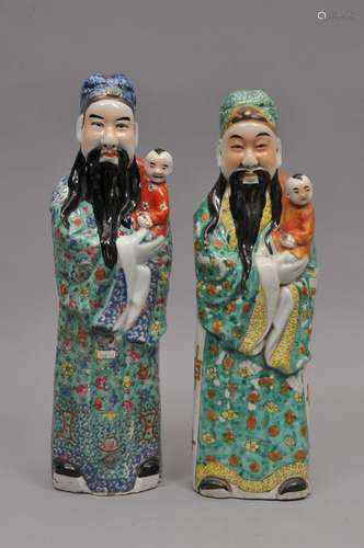 Pair of porcelain figures. China. Mid 20th century. Two of the Gods of Wealth. Famille Rose decoration. 17-1/2