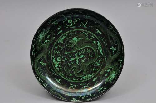 Porcelain dish. China. 20th century. Decoration of green dragons, celestial pearls and clouds on a black ground. 9