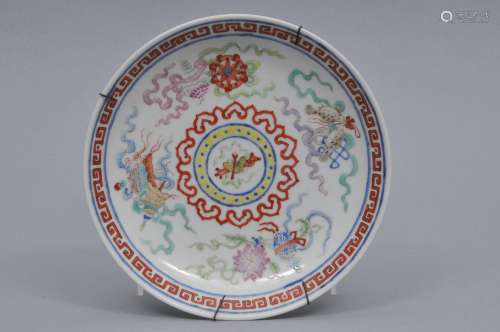 Porcelain saucer dish. China. Tung Chih mark (1861-1874) and of the period. Famille Rose decoration of 
