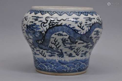 Porcelain vase. China. 19th century. Underglaze blue decoration of a celestial pearl and two flanking dragons with clouds. Jui borders and a wave motif at the base. 10-1/2