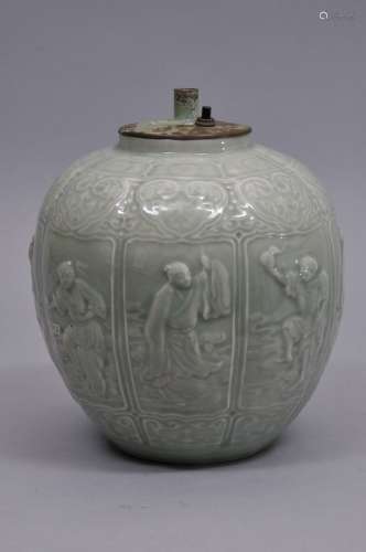 Porcelain vase. China. 19th to early 20th century. Celadon glaze with moulded decoration of the eight immortals with ju-i borders. Hardwood stand. 8-1/2