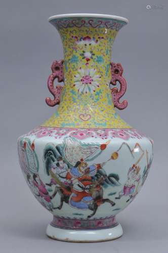 Porcelain vase. China. Late 19th century. Famille Rose decoration of an historical scene with dragon handles and borders of yellow with lotus scrolls and pink ju-i. Ch'ien Lung mark on the base. 15