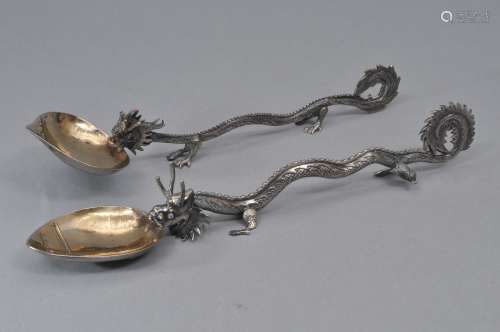 Pair of silver serving spoons. China. 19th century. Dragon handles. Gold washed bowls. Signed. 8