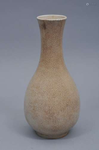 Porcelain vase. China. 19th century. Cream coloured crackled glaze. 11