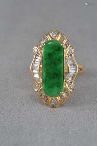 Jade ring. Bright green colour set with diamonds. 14 KT gold setting.