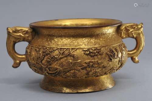 Gilt copper censer. Ch'ien Lung mark. (1735-1796) and of the period. Dragon's head handles. Surface decorated with mythical animals on a brocade ground. 6-1/4