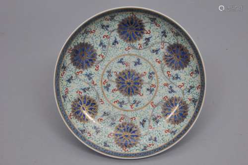 Porcelain dish. China. Tung Chih mark and possibly of the period. Underglaze blue decoration of lotus scrolls with gilt. Surfaces enameled with red, green and yellow scrolls. 9-1/4