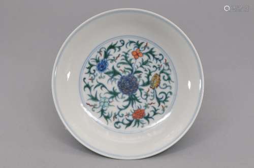 Porcleain saucer dish. China. 20th century. Tou Tsai ware. Decoration of floral scrolling. Ch'ien Lung mark. 6-1/4