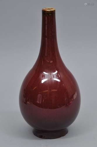 Porcelain vase. China. Early 20th century. Bottle form. Yao glaze of purple red. 10