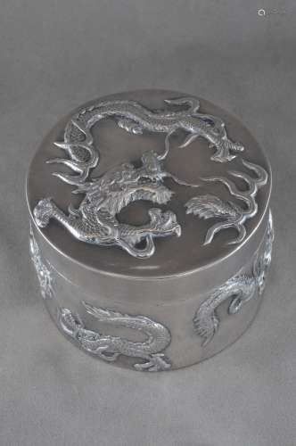 Round silver box. China. 19th century. Repousse decoration of dragons. Signed. 3-1/4