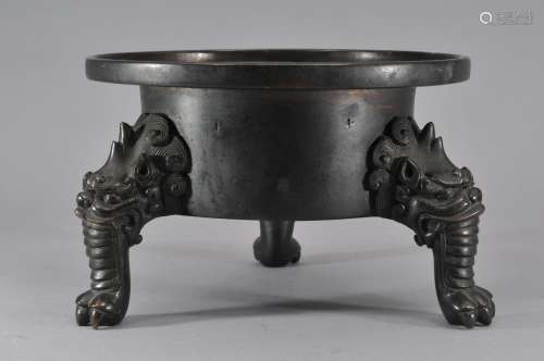 Bronze censer. China. Ming period. (1368-1644). Animal head and claw feet. Deep black patina. 7-1/2