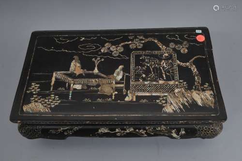 Wooden stand. China. 18th century. Black lacquered surface inlaid with mother of pearl. Decoration of scholars in a landscape, flowering branches and brocade patterns. 18