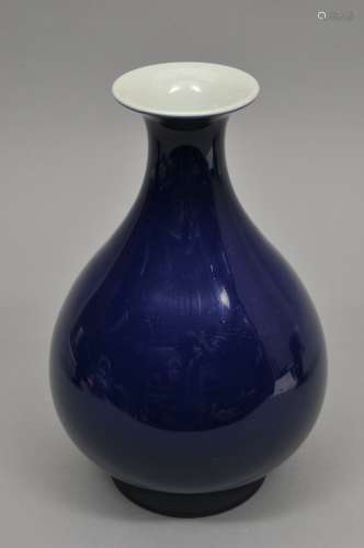 Porcelain vase. China. 20th century. Pear shaped with a flaring mouth. Deep cobalt blue monochrome. Ch'ien Lung mark. 10-1/2