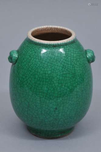 Porcelain vase. China. 19th century. Oviform shape with foo dog handles. Camelia leaf green glaze with pronounced crackle. 6-1/2