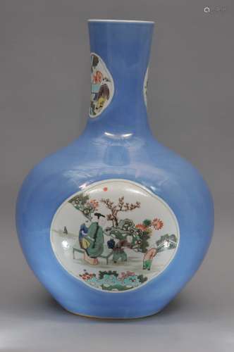 Large porcelain vase. China. Early 20th century. Bottle form. Powder blue ground with Famille Verte reserves of women and children. 24