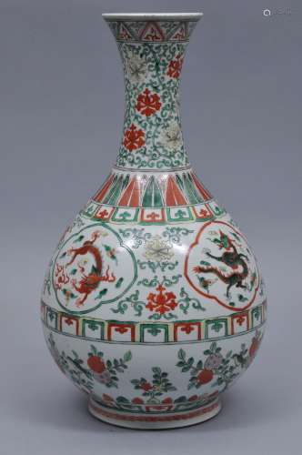 Porcelain vase. China. 19th century. Pear shaped with a flaring neck. Famille verte decoration of dragons, birds and flowers and floral scrolling. 16