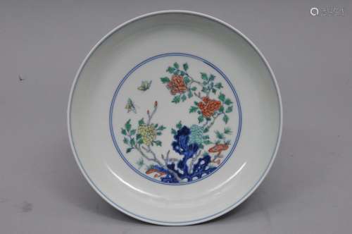 Porcelain dish. China. 20th century. Tou Tsai decoration of scholars rocks, flowers and butterflies. 8-1/4