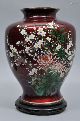 Cloisonné vase. Japan. Circa 1950. Pigeon blood red bas taille enamel with standard cloisonné decoration of flowers. 12-1/2