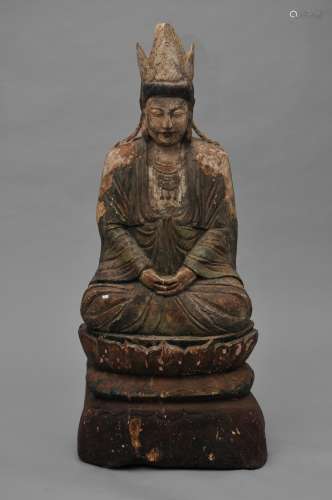 Wood carving. China. 19th century. Seated figure of a Buddha. Traces of pigment remaining. 39