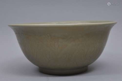 Celadon bowl. China. 19th century. Lung Chuan ware. Bell shaped. Surface carved with floral scrolling. Burnt orange foot. 13