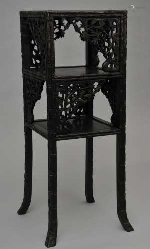 Hardwood stand. China. 19th century. Marble inset top with two tiers. Aprons and feet carved with bamboo. 15