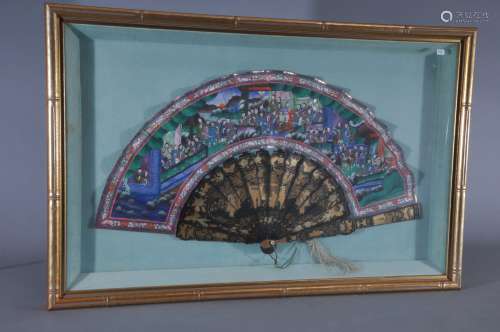Chinese Export fan. 19th century. Lacquered stays. Painted figures with textile collage. 20