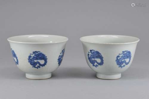 Pair of porcelain bowls. China. 20th century. Decoration of dragon roundels in underglaze blue. K'ang Hsi mark. 3-3/4