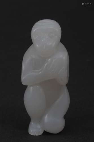Jade carving. China. 20th century. White stone carved as a monkey. 2-1/4