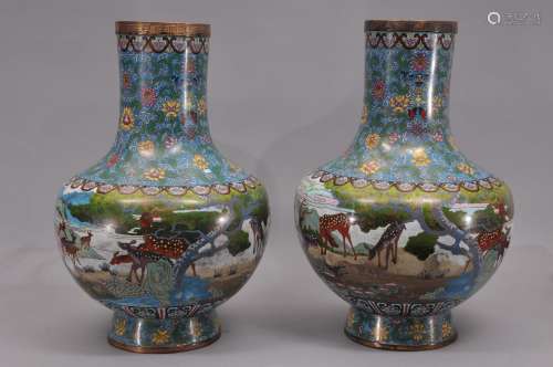 Pair of large Cloisonné vases. China. First half of the 20th century. Bottle form. Decoration of deer in a landscape and floral scrolling. 23
