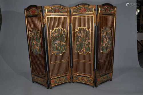 Four panel folding screen. Japan. Meiji period. (1868-1912). Carved painted and gilt wood engraved gilt copper mounts. Decoration of birds and flowers with floral scroll borders. 39