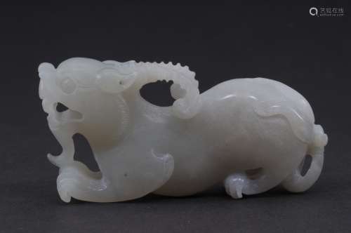 Jade carving of a horned mythical animal. China. 20th century. Grey white stone. 3