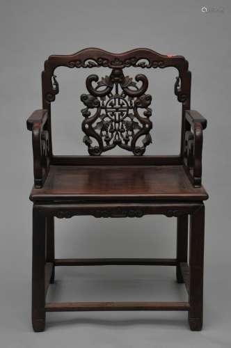 Hardwood chair. China. 19th century. Back splat carved with a bat, shou medallions, double gourds and a pair of Ju-i scepters. 24-1/2