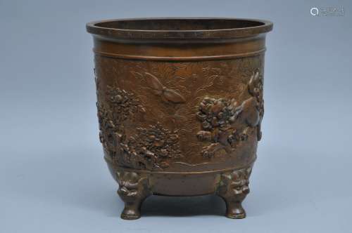 Bronze planter. Japan. Meiji period. (1868-1912). Shishi mask feet. Relief decoration of shishi and peonies engraved floral scrolling. 12