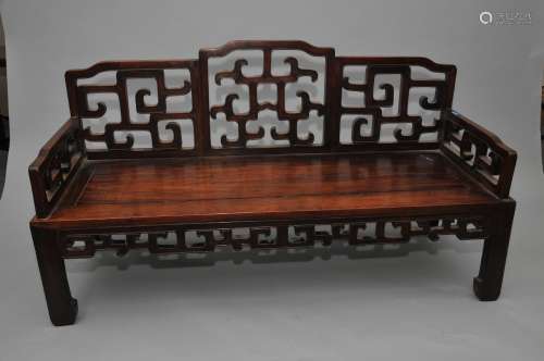 Hardwood couch. China. 19th century. Archaic scroll on back, sides and aprons. 60-1/2