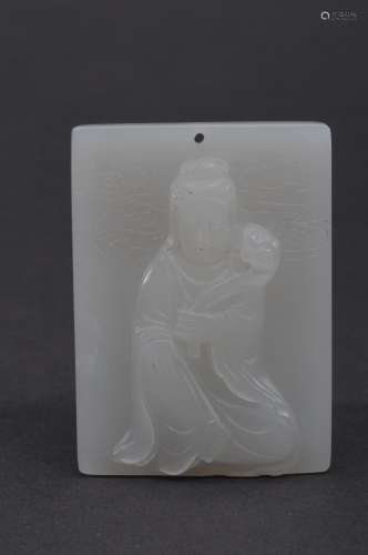 Jade plaque. China. 20th century. Rectangular form carved in relief with Kuan Yin. 2-1/4