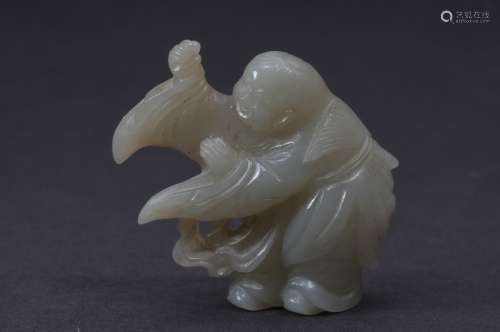 Jade carving. China. 19th century. Celadon colored stone. Boy in flowing robes. 2