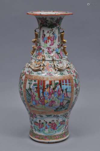 Chinese Export vase. Relief dragons and foo dogs on the neck and shoulder. Famille rose mandarin decoration. 17-3/4